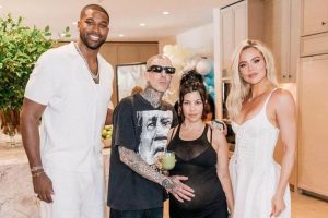 Tristan Thompson poses with Kourtney & Khloe Kardashian Tristan Thompson poses with Kourtney & Khloe Kardashian