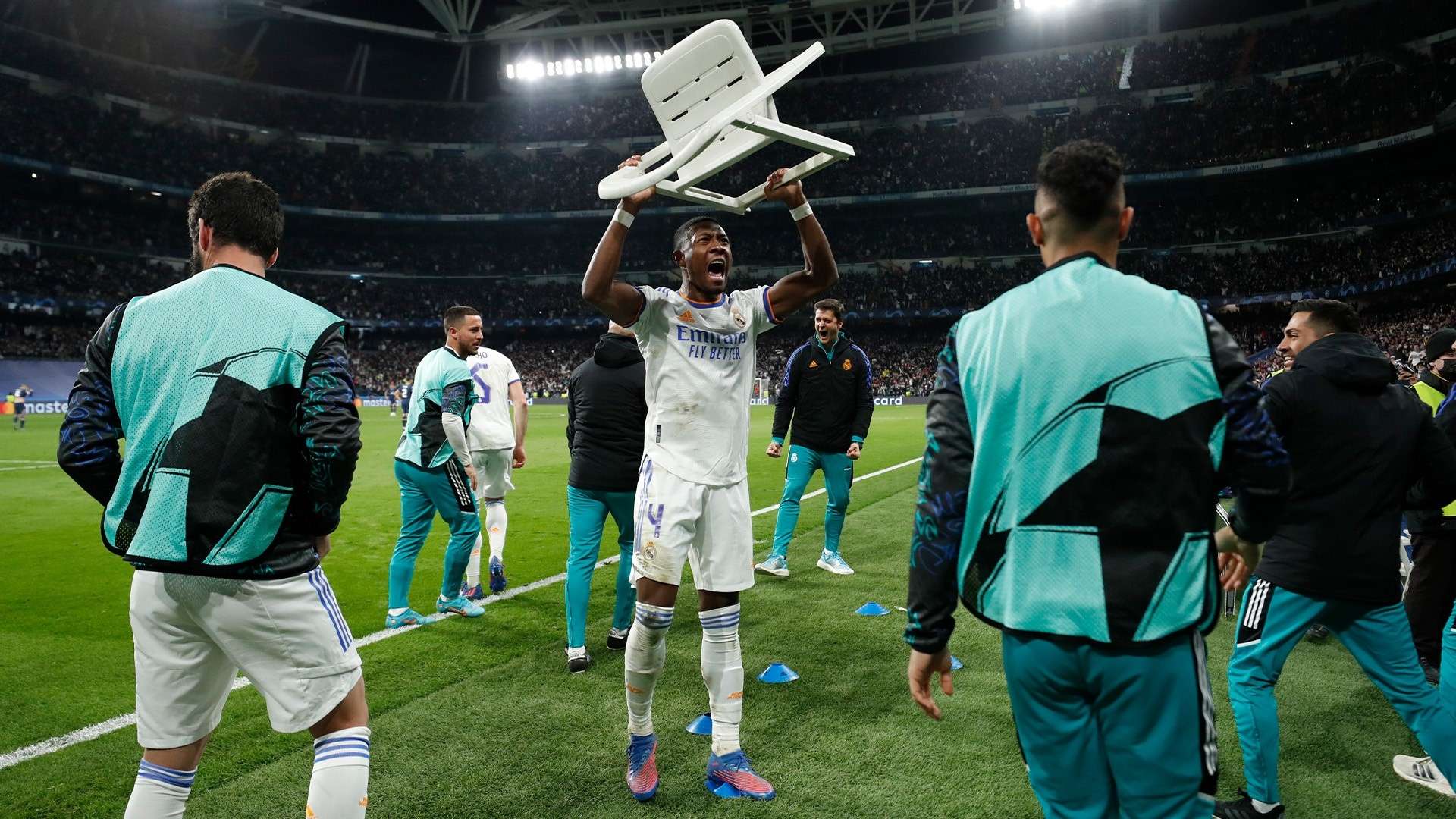 Real Madrid fans wave chairs in the air for Alaba  